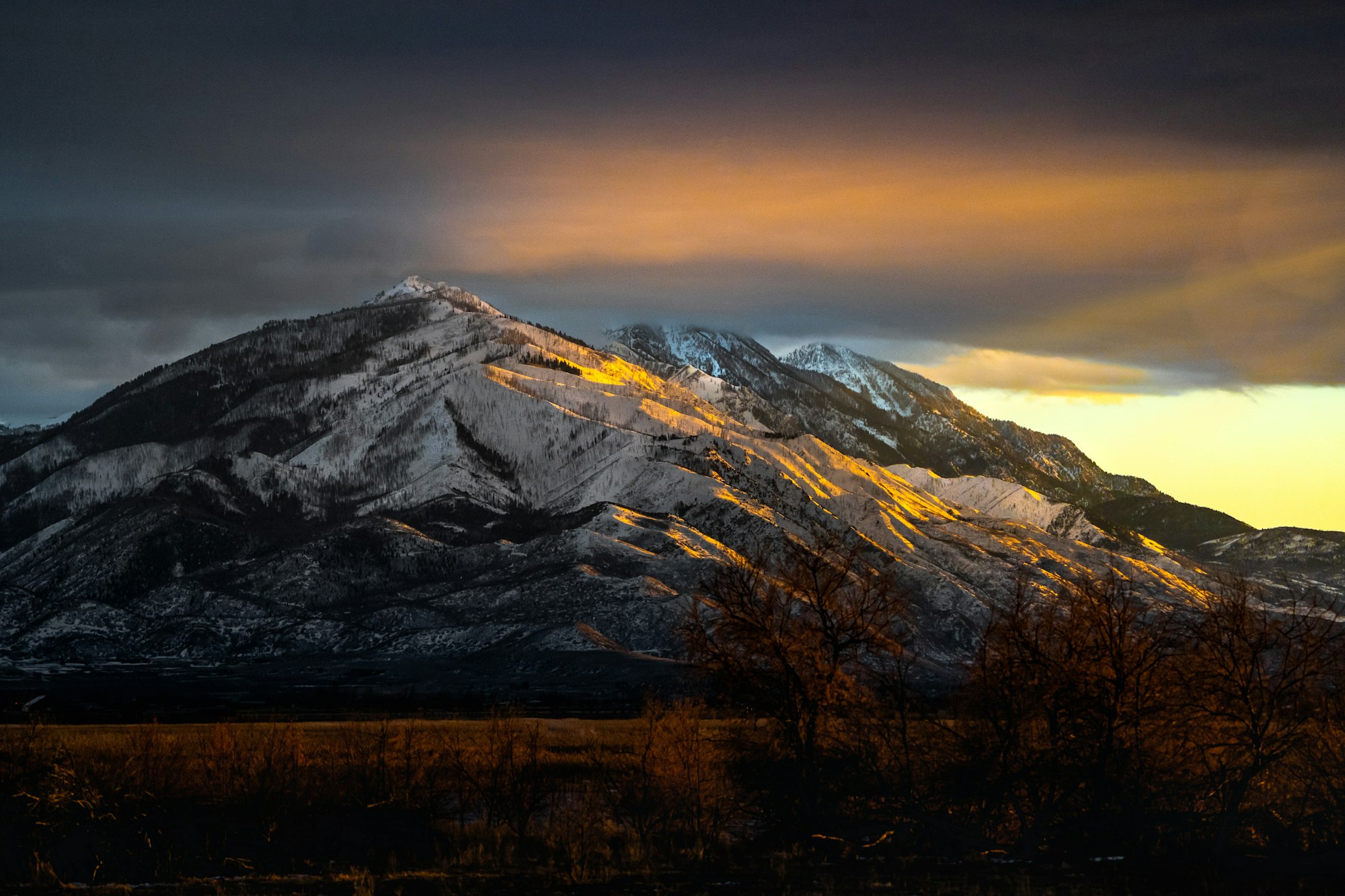 Golden evening light on the snow-covered Wasatch Range.